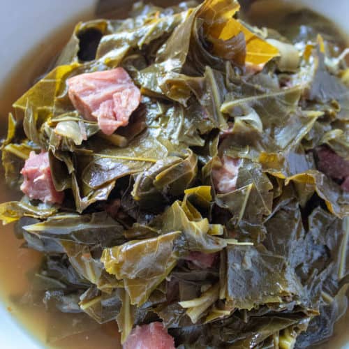 Instant Pot Collard Greens, close up in serving bowl with spoon.