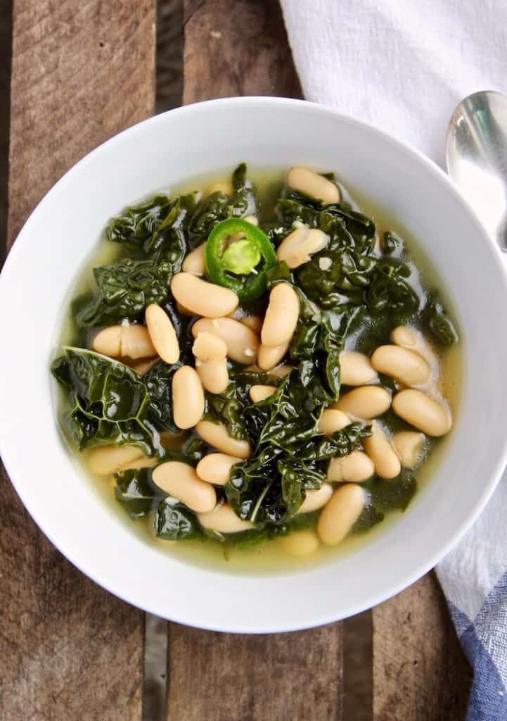 Tuscan Kale and Cannellini Bean Soup in white bowl