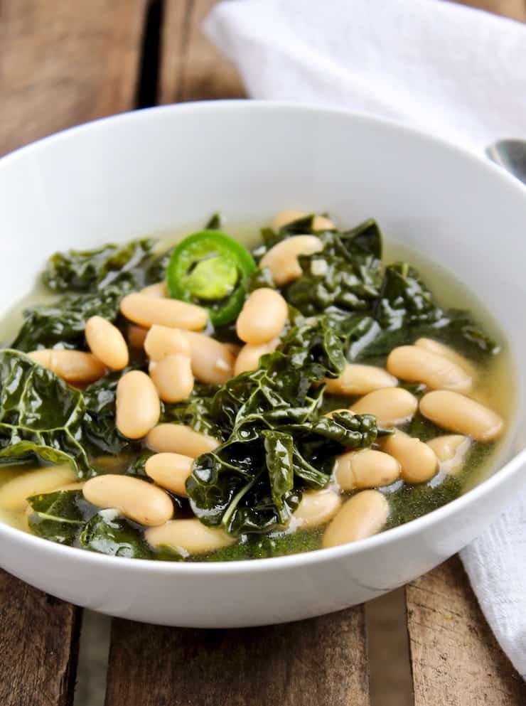 Tuscan Kale and Cannellini Bean Soup in white bowl