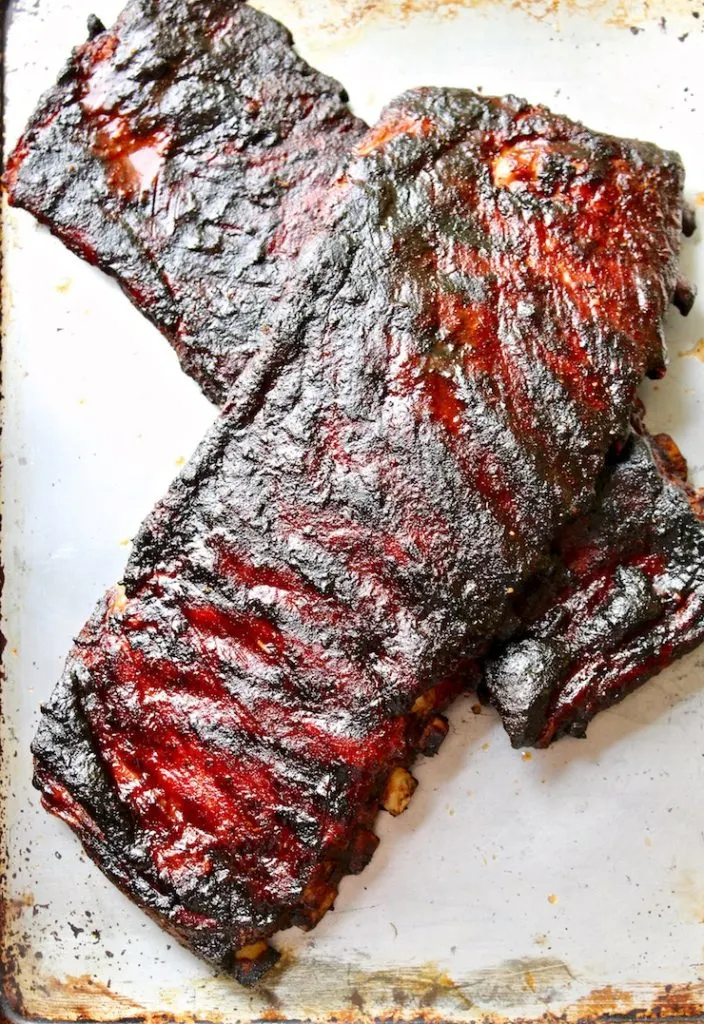 Two slabs of cooked St. Louis style ribs.