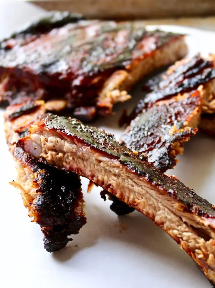 St. Louis style BBQ ribs, close up of single rib section.