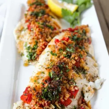 Greek baked fish on serving platter.
