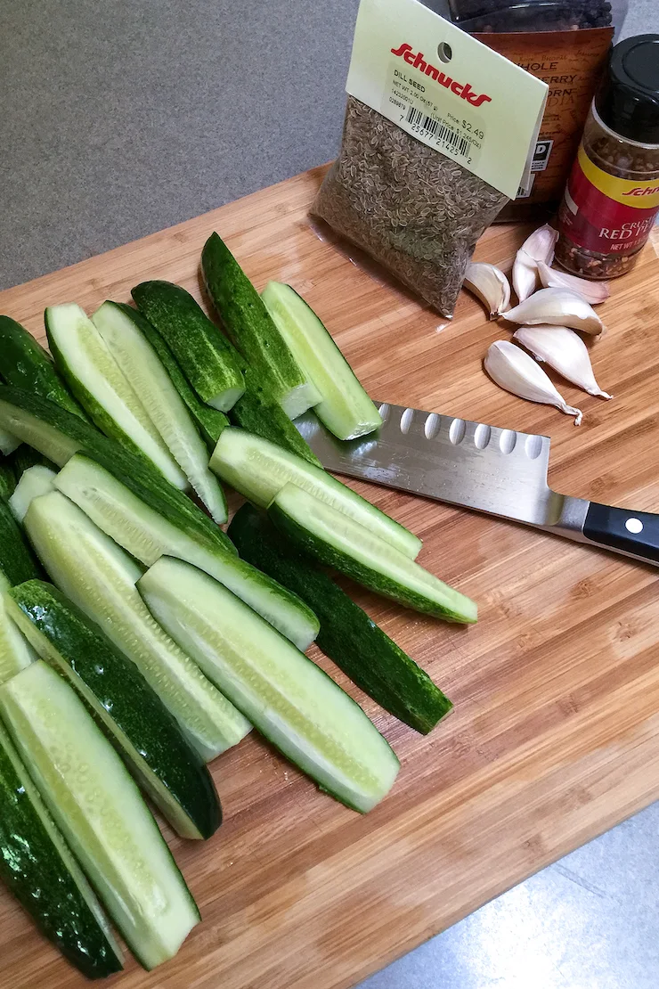 Cutting cucumbers into spears.
