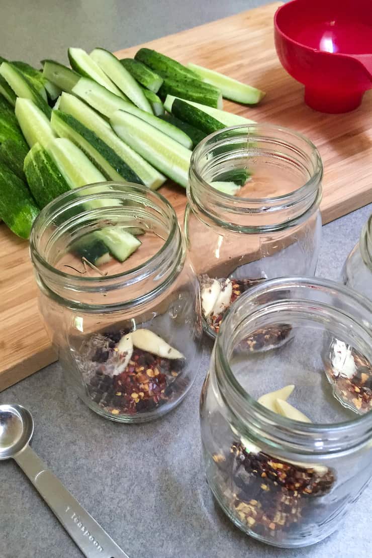 Seasonings in bottom of jars for dill pickles.