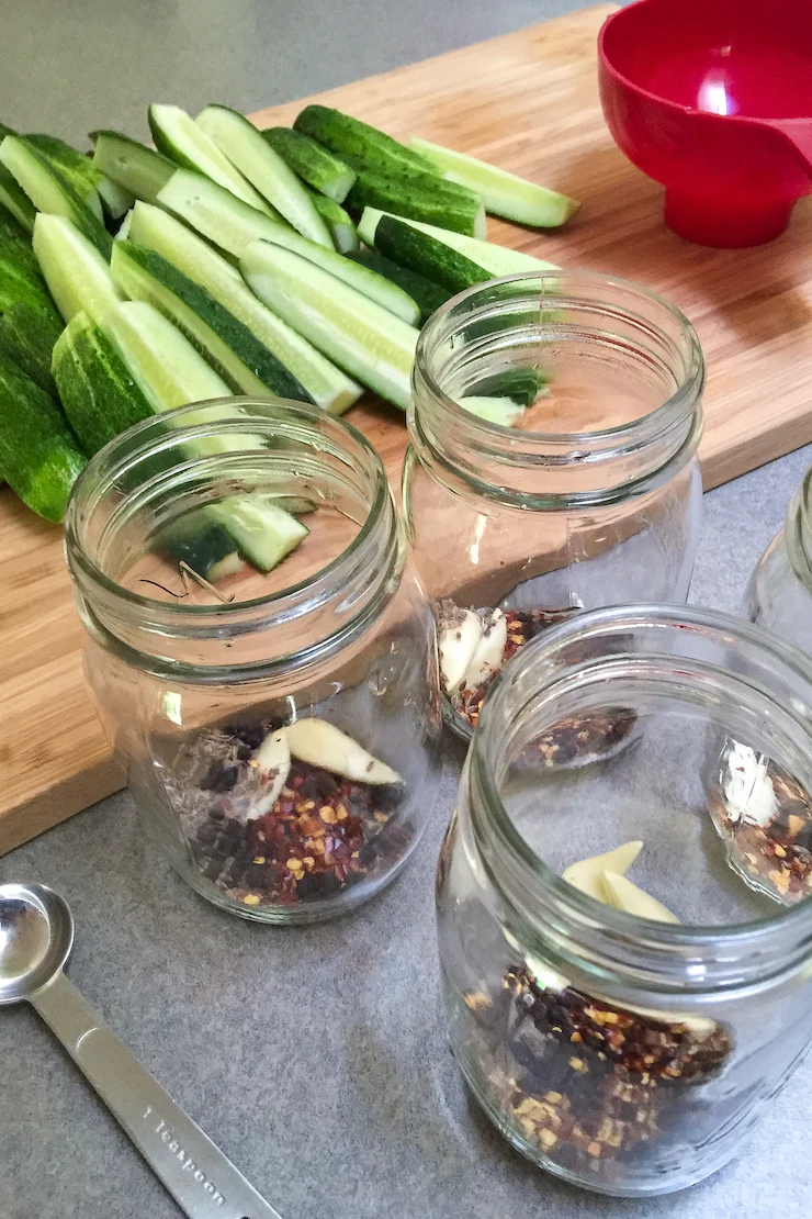 Seasonings in bottom of jars for dill pickles.