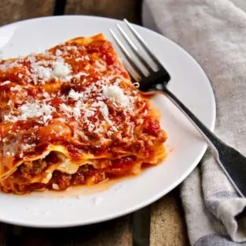 Mom's Lasagna, piece on serving plate with fork