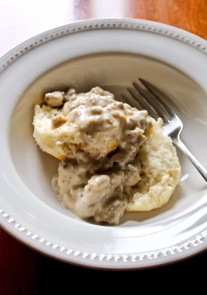 Sausage Gravy and Biscuits in bowl with fork