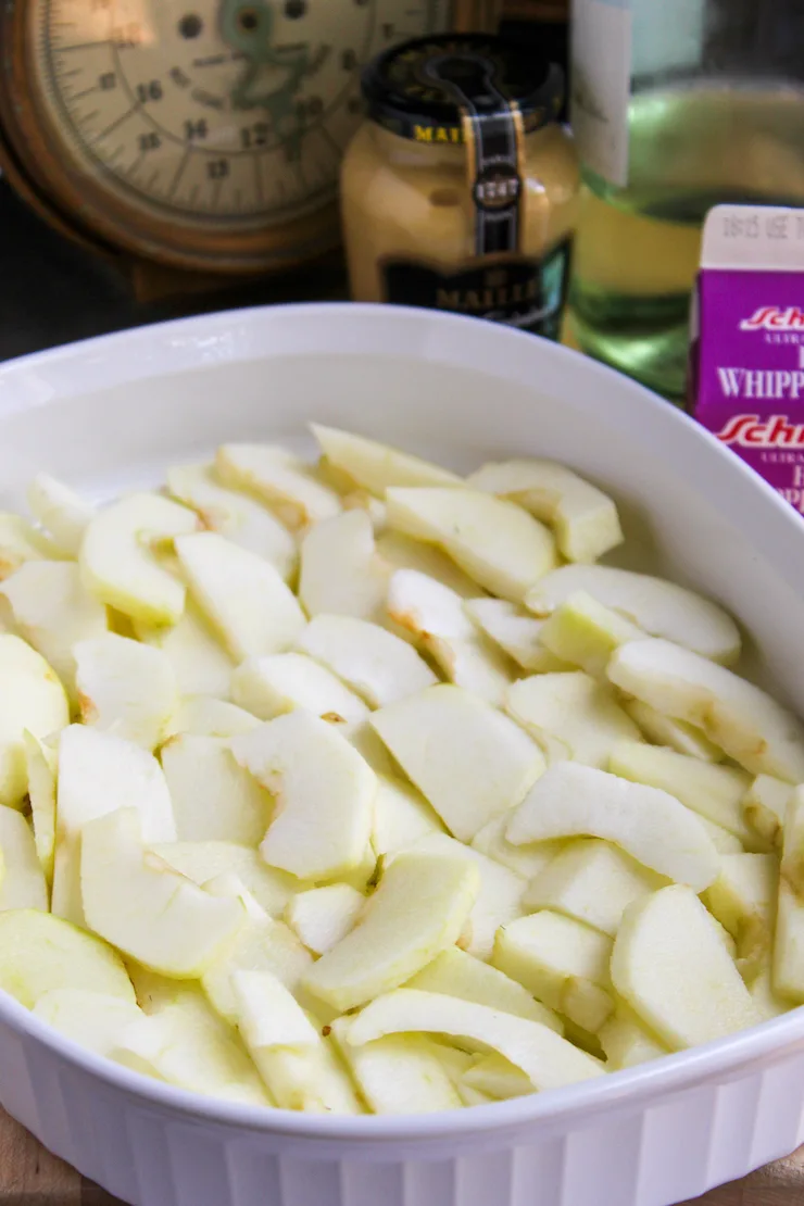 Apples slices in baking dish ready for oven.