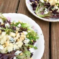 Pear and blue cheese salad on two salad plates.