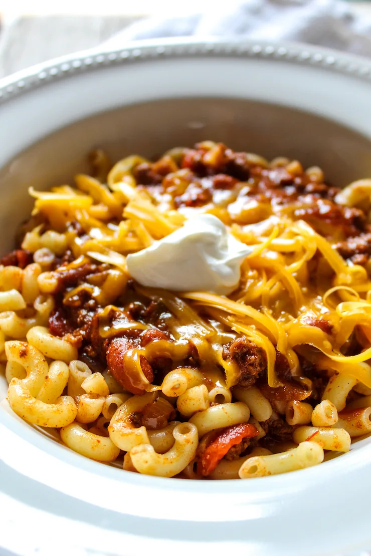 Close up of chili in serving bowl with toppings.