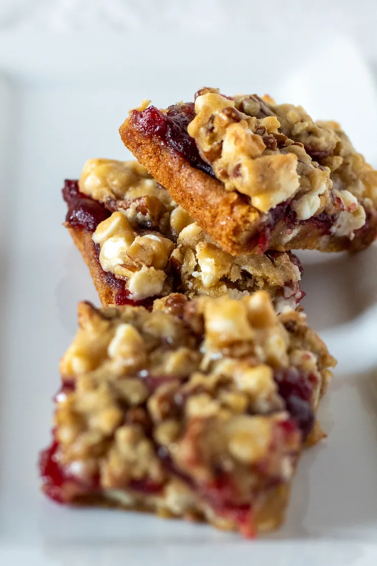 White chocolate cranberry bars on serving plate.