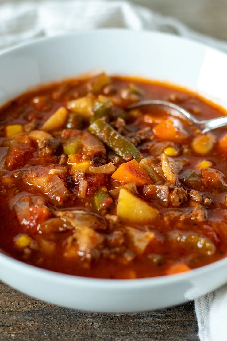 Bowl of soup with spoon.