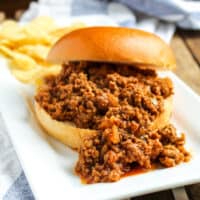 Sloppy Joe and chips on plate.