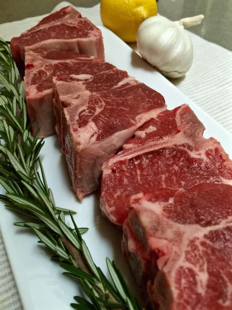 Close up of uncooked loin chops.