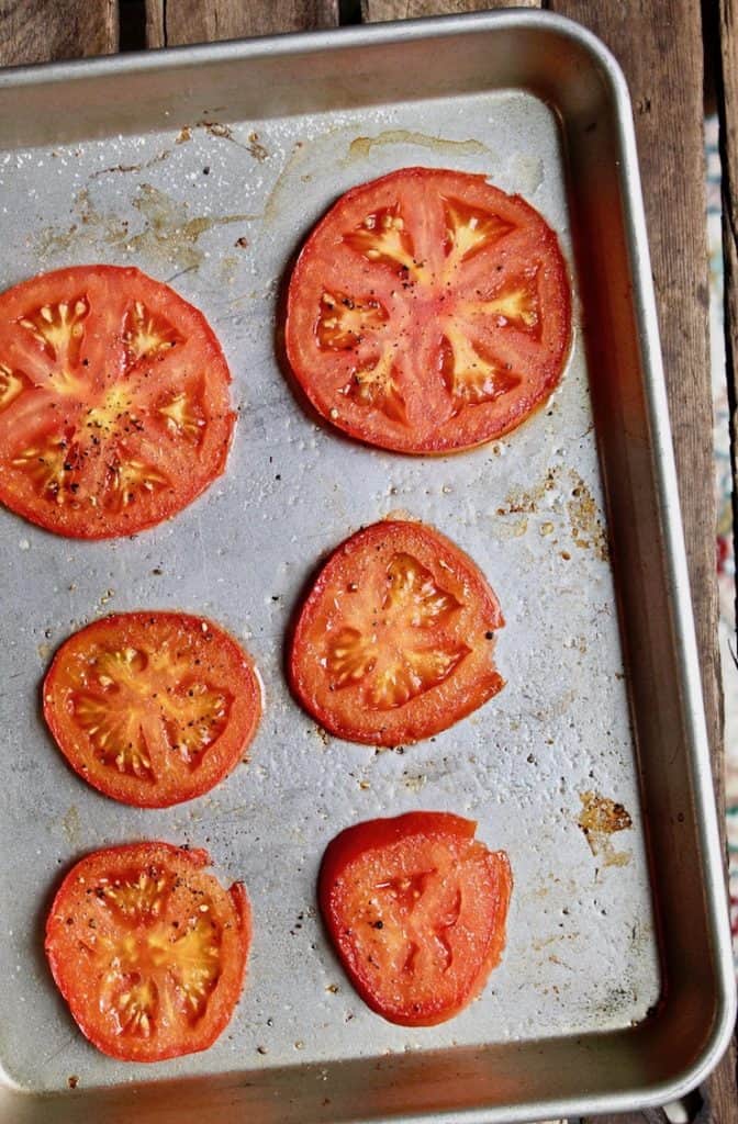 Roasted tomato slices on sheet pan.