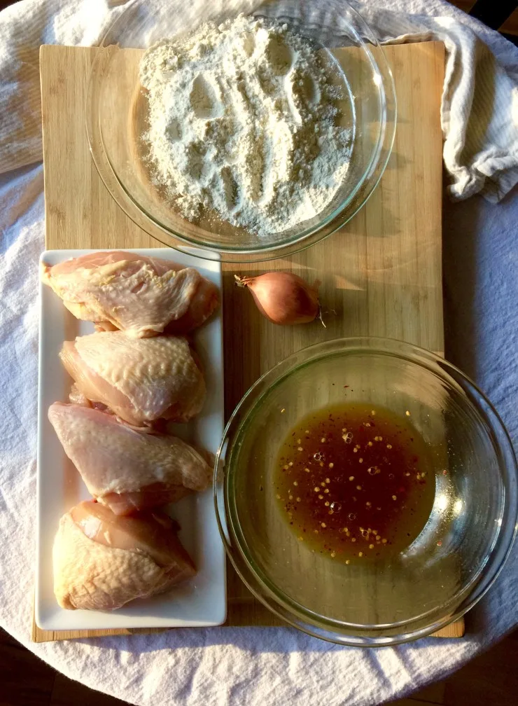 Ingredients for orange glazed chicken on cutting biard.
