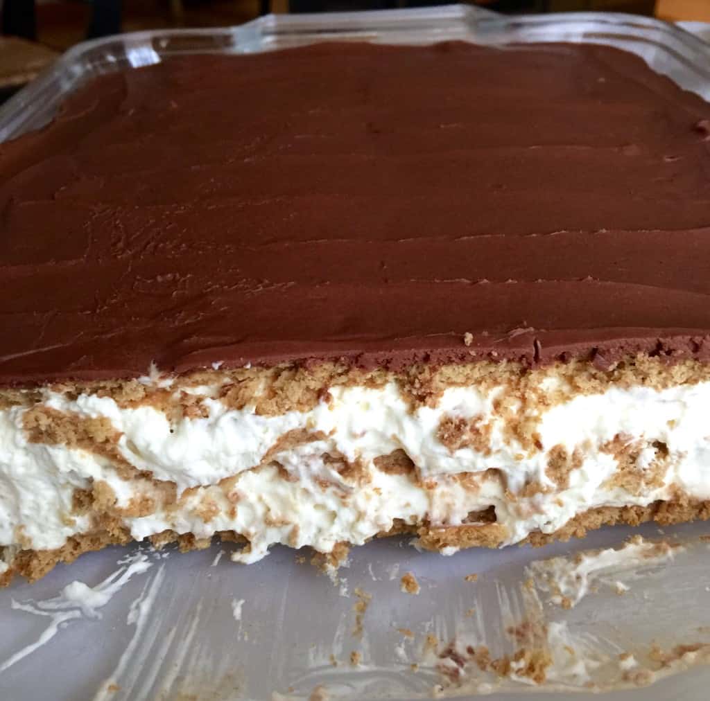 Éclair Cake, in pan, cut to show layers.