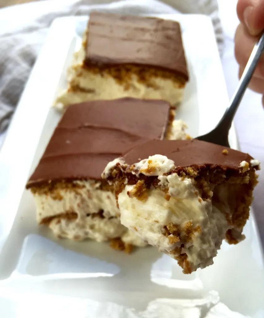 Éclair Cake, forkful of cake, slices in background.