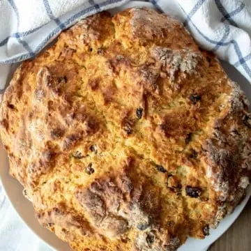 Irish Soda Bread, round loaf on serving plate.