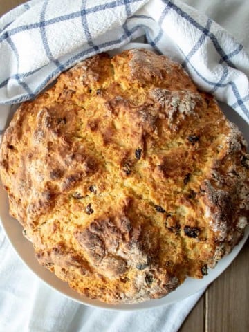 Irish Soda Bread, round loaf on serving plate.