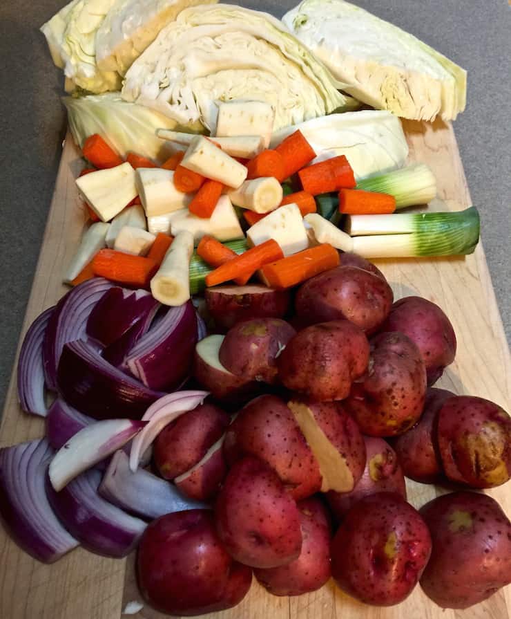 Corned Beef and Cabbage, vegetables prepped on cutting board.