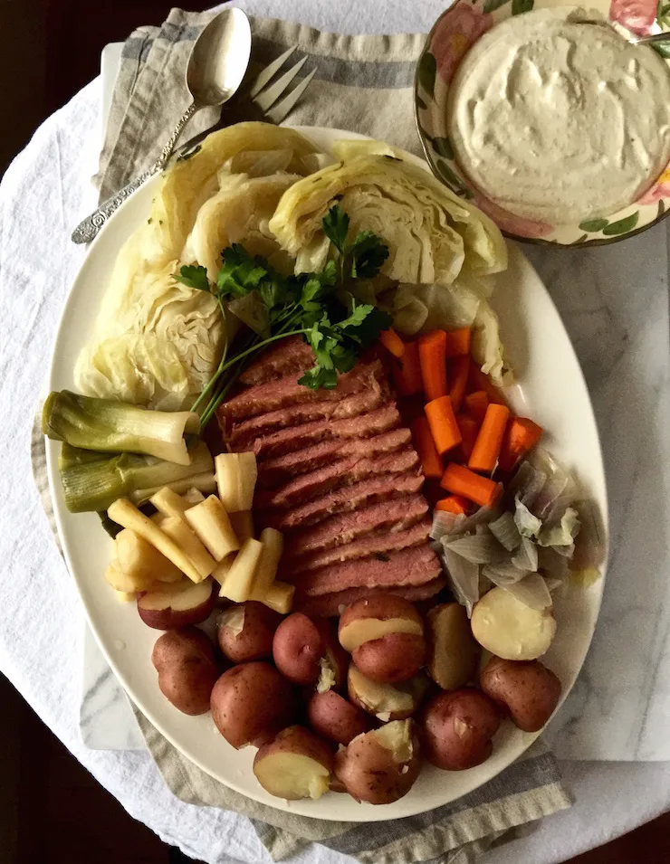 Corned Beef and Cabbage, on serving platter with bowl of horseradish cream sauce.