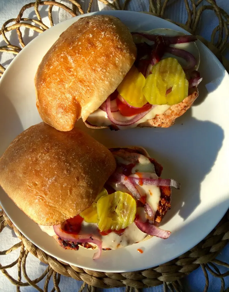 Grilled Pork Tenderloin Sandwiches, two sandwiches on a plate