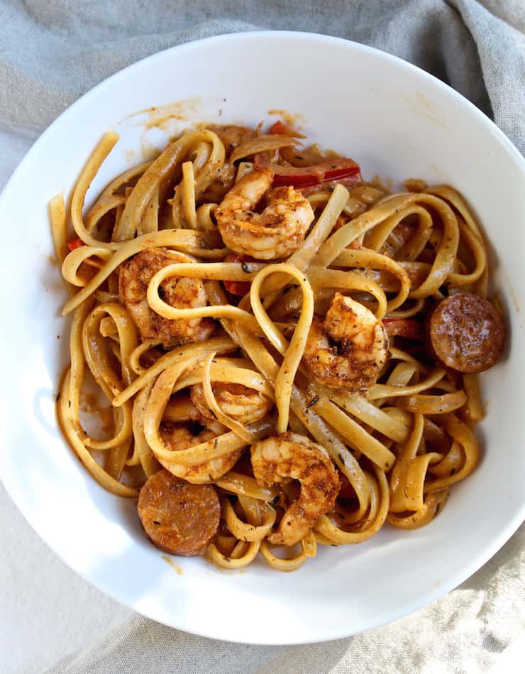 Creamy Cajun Shrimp Pasta with Sausage in white bowl