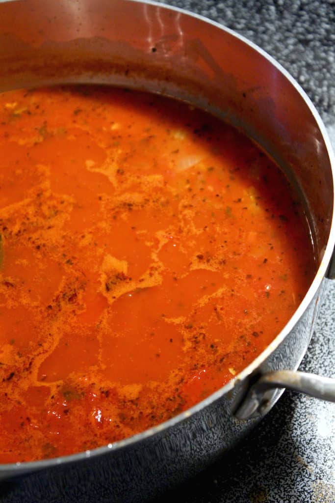 Sauce simmering in pot.