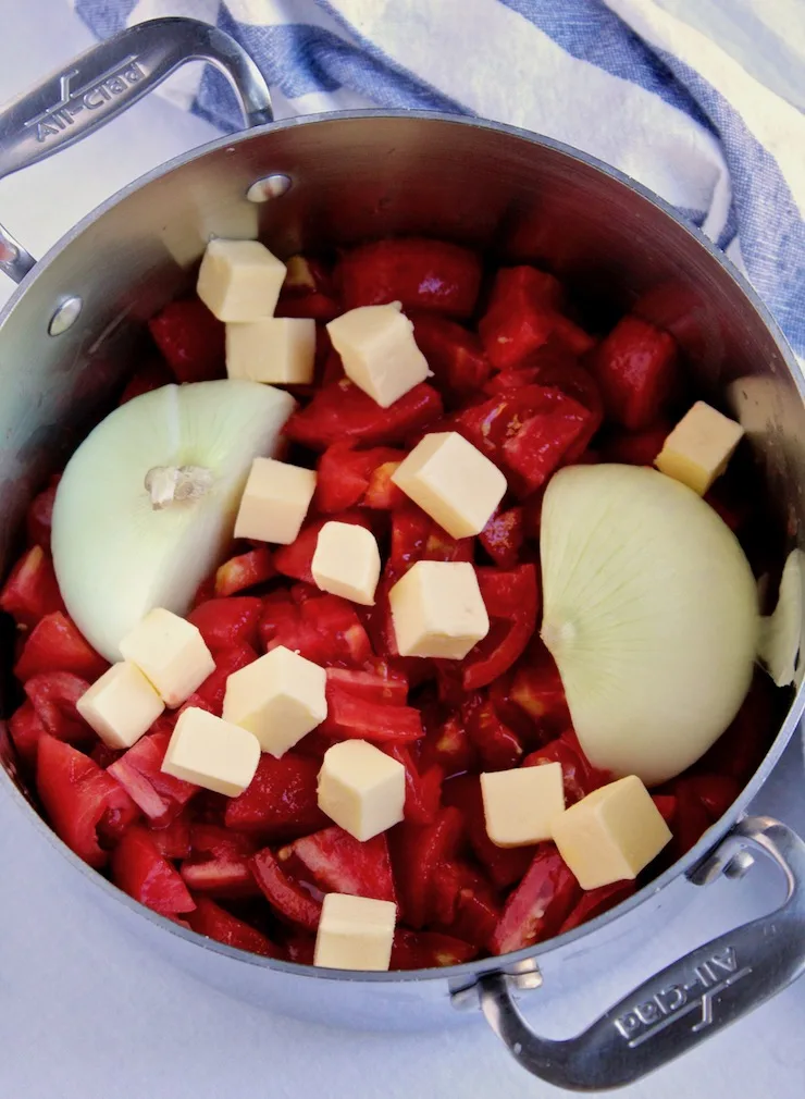 Pot on stove with marinara ingredients