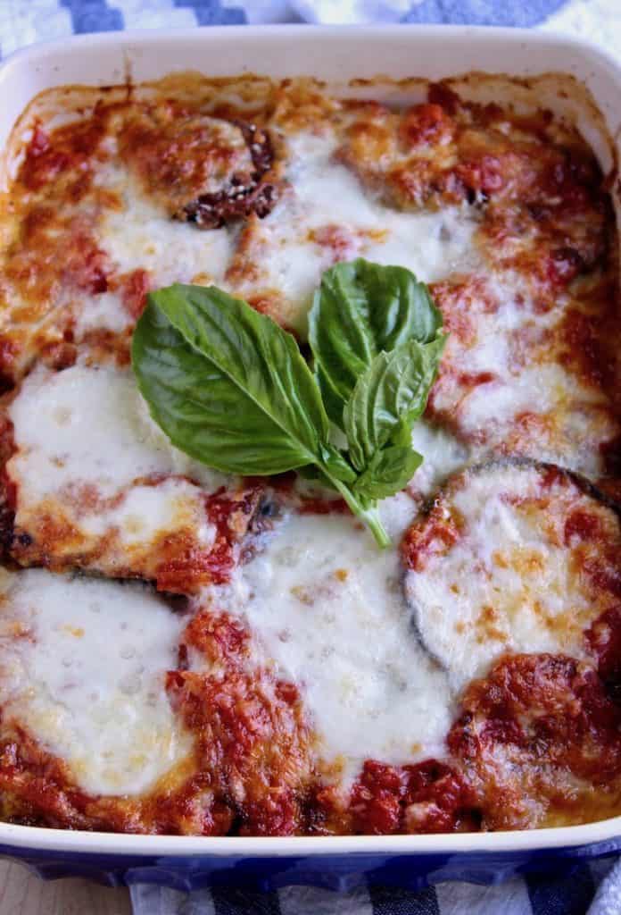 Overhead photo in baking dish with fresh basil leaves