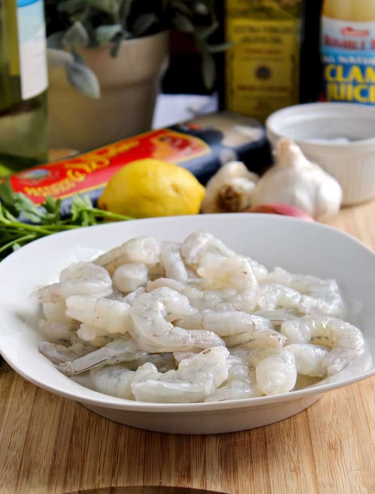 Raw shrimp surrounded by ingredients