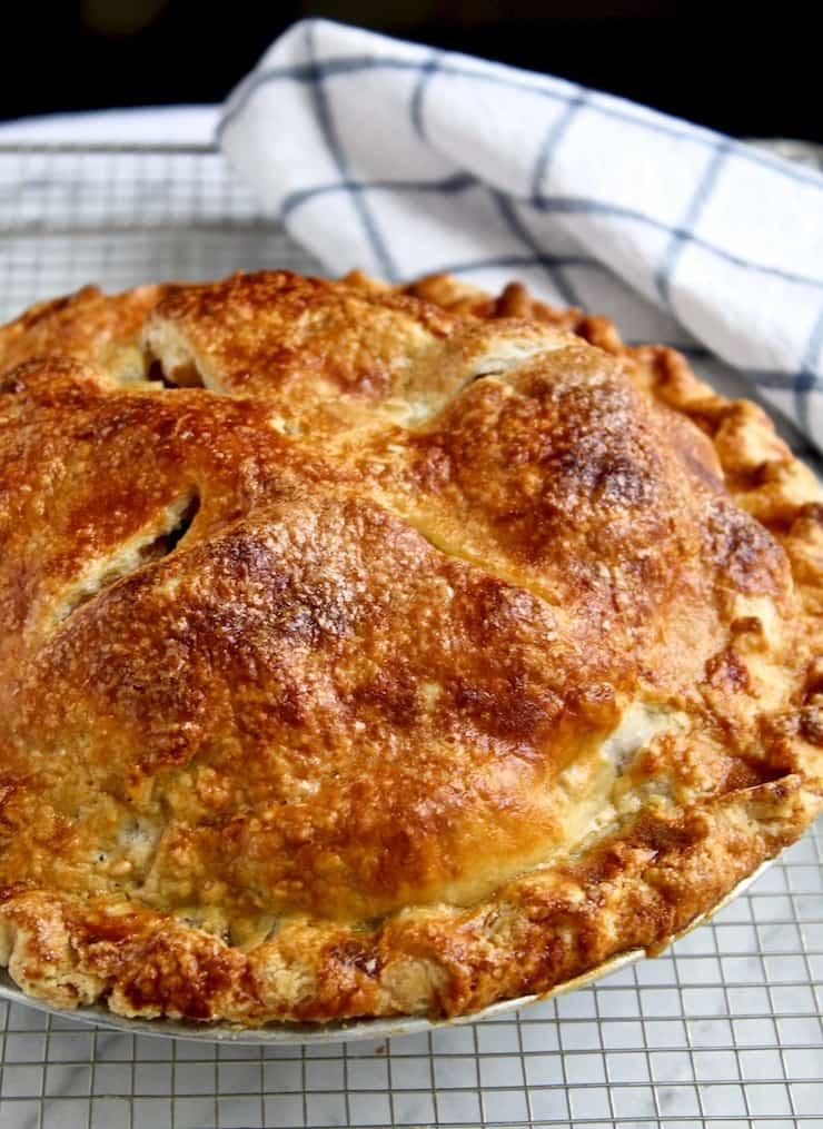 Apple pie close up, browned and crispy crust