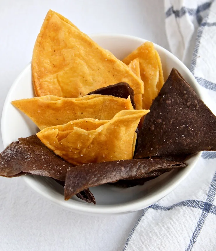 Homemade yellow and blue corn tortilla chips.