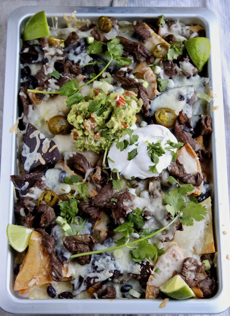 Loaded Steak Nachos, overhead in sheet pan.