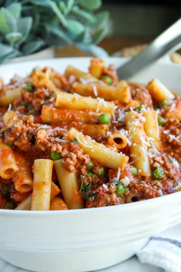 Pasta in white serving bowl.