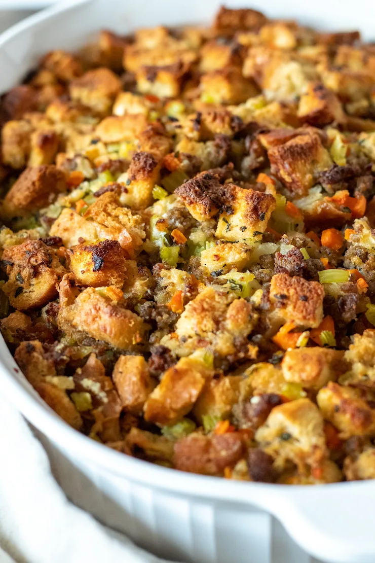 Closeup of old fashioned bread stuffing with browned, crispy top.