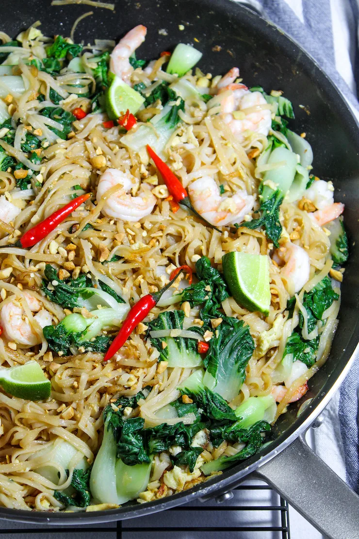 Pad see ew with shrimp in pan.