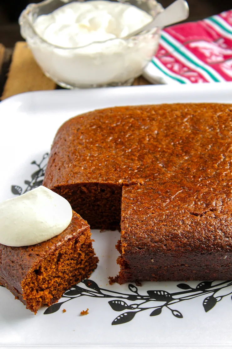 Gingerbread cake with whipped cream.