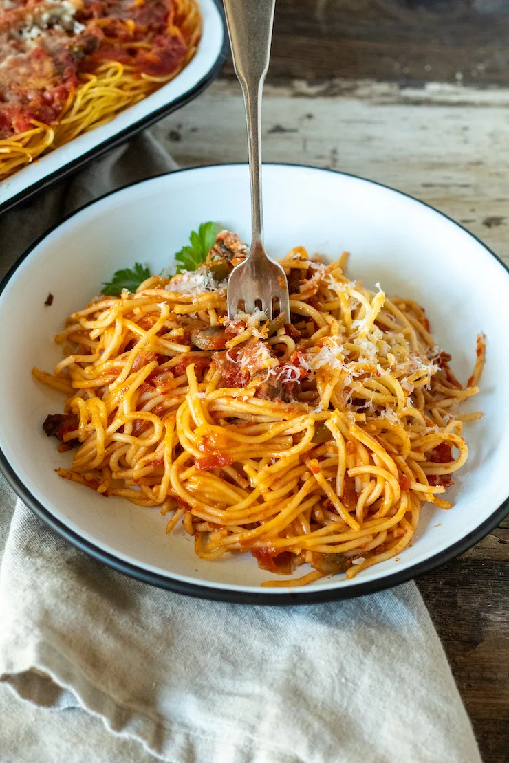 Plate of Granddad's Italian baked spaghetti with a fork.