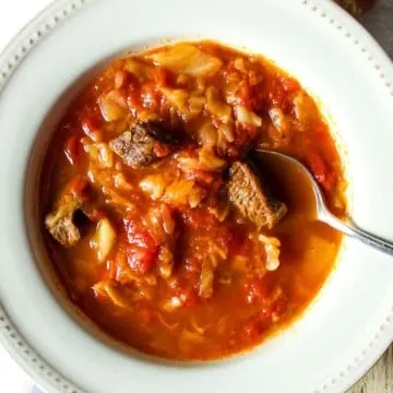 Soup in bowl with spoon.