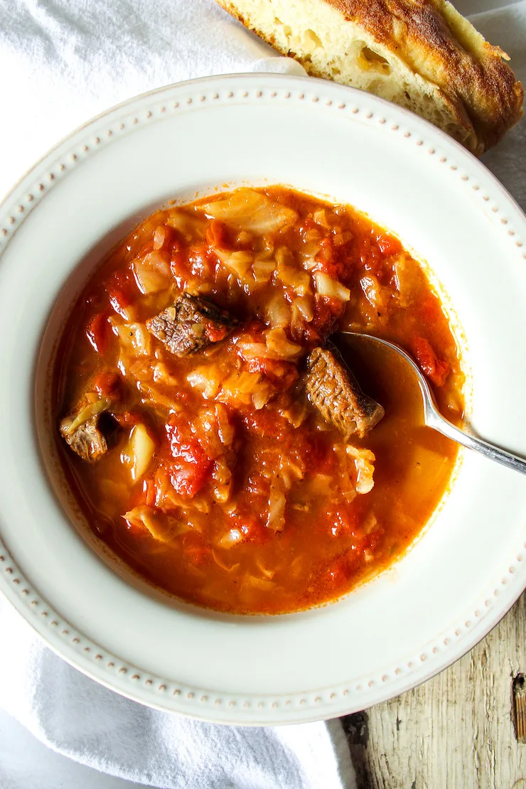 Soup in bowl with spoon.