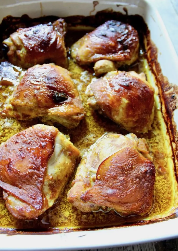 No Work Chicken baked thighs in baking dish in sauce.