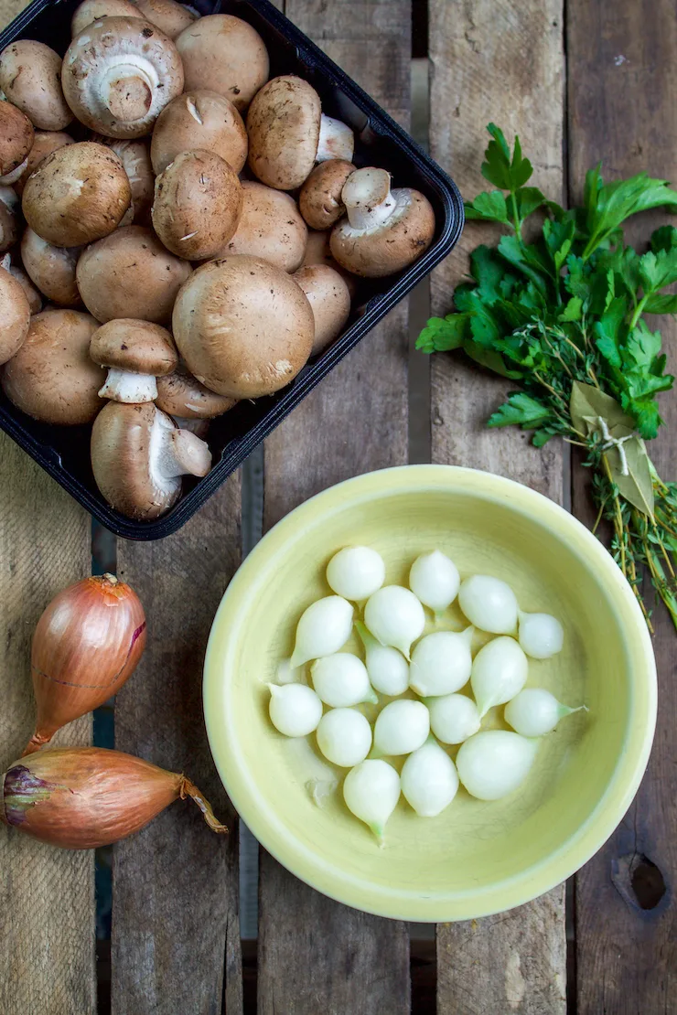 Mushrooms and pearl onions ingredient photo.