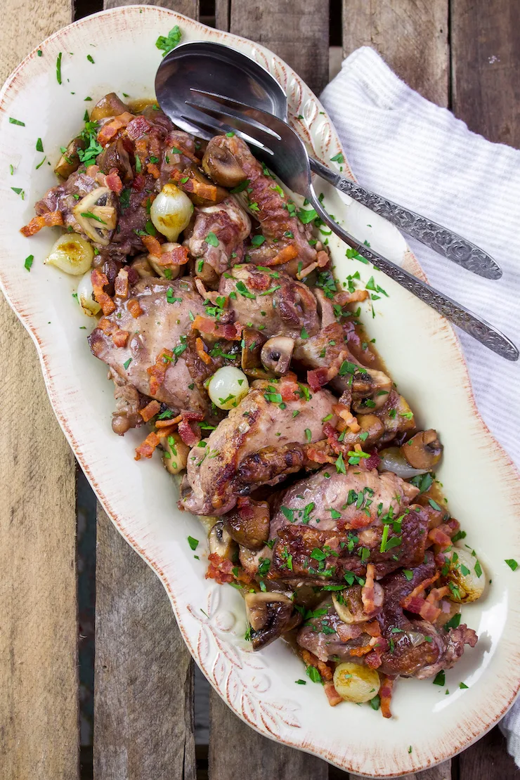 Finished coq au vin on serving platter.