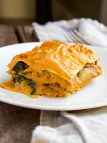 Plated piece of lasagna.