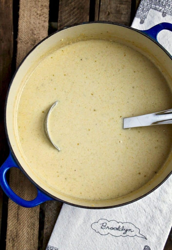 Irish Beer Cheese Soup, in soup pot with ladle.