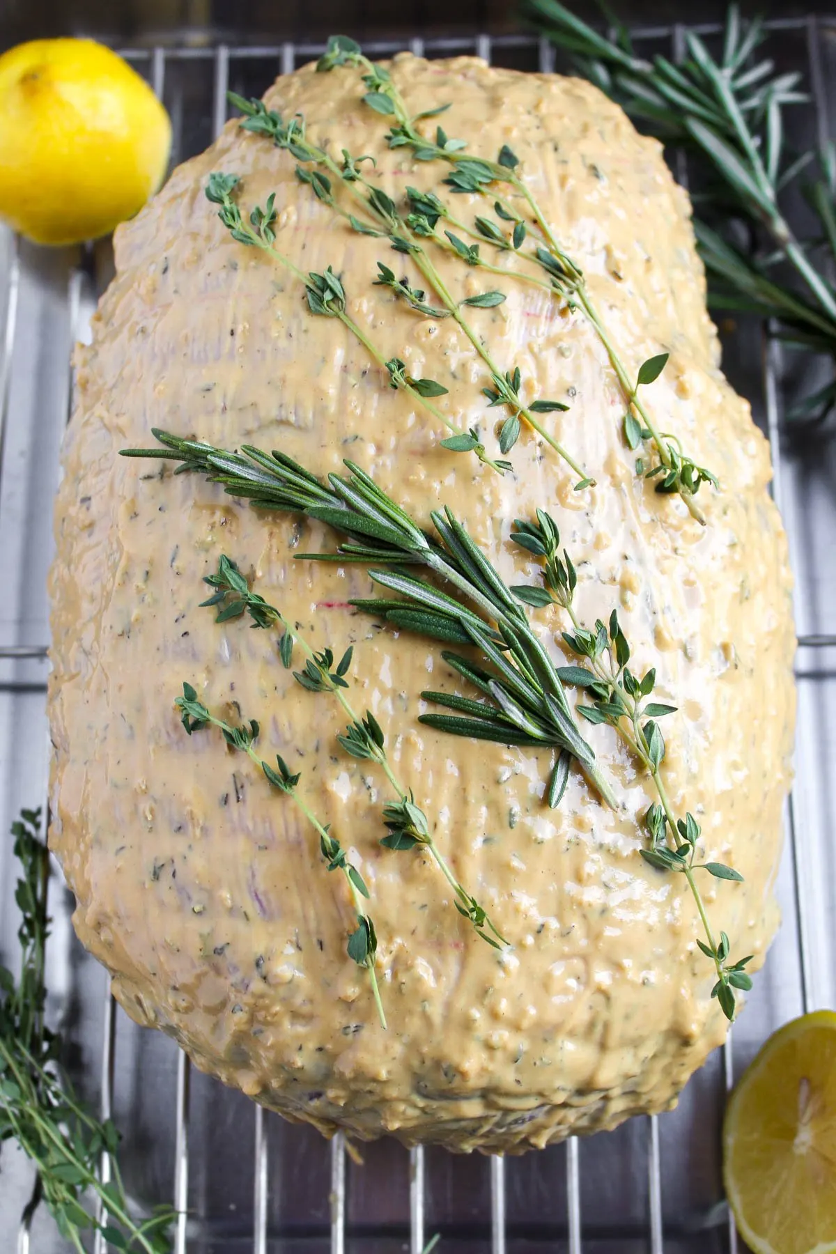 Leg of lamb with mustard mixture ready for the oven.