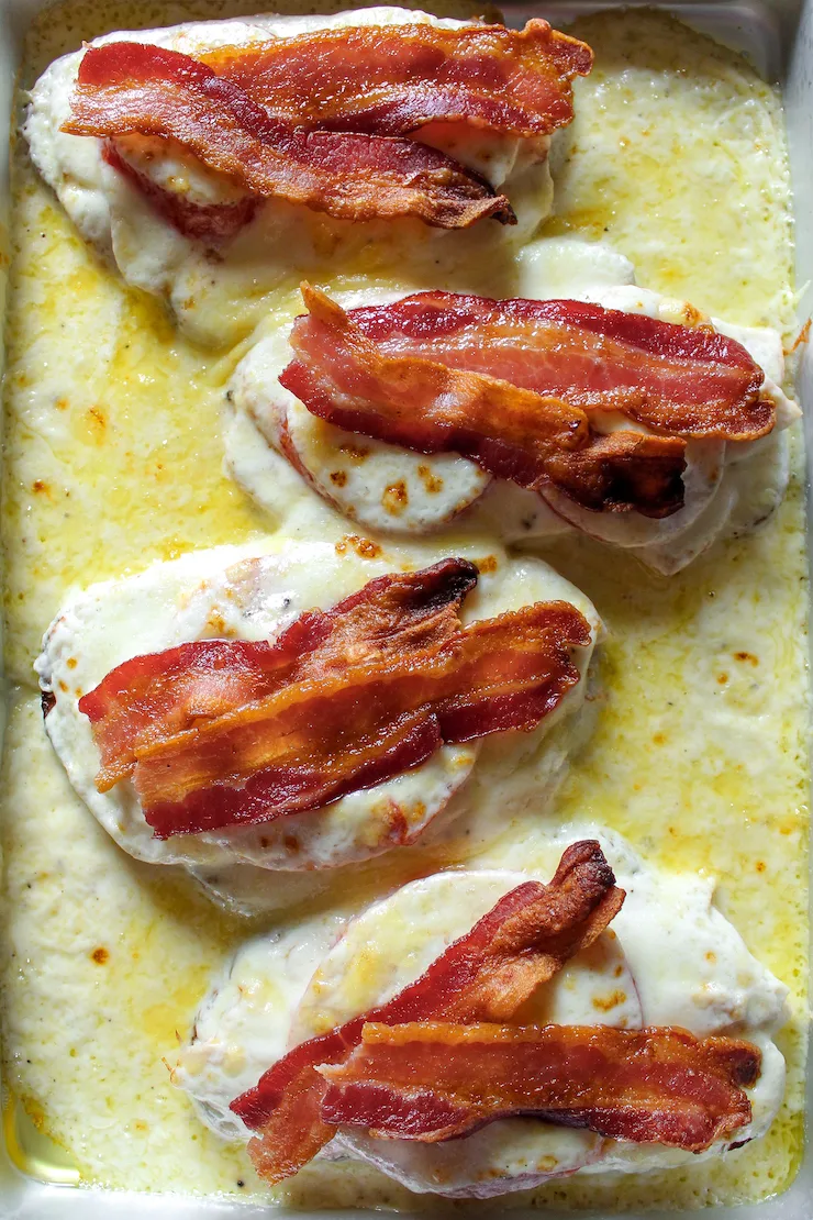 Finished hot brown sandwiches on sheet pan.