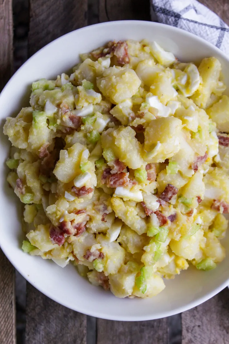 German potato salad in serving bowl.